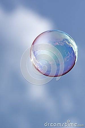 Reflection of houses and clouds in a floating bubble Stock Photo