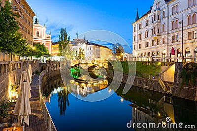 Reflection in Ljubljanica river and surrounded buildings Stock Photo