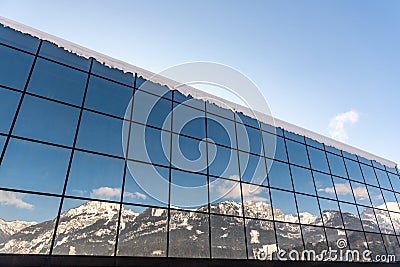 Reflection of mountains in a glass building - Ski station Hauser Kaibling One of Austria`s top ski resorts interlinked 4 mountains Editorial Stock Photo