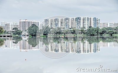 Reflection of new estate HDB housing complex on Jurong Lake, Sin Stock Photo