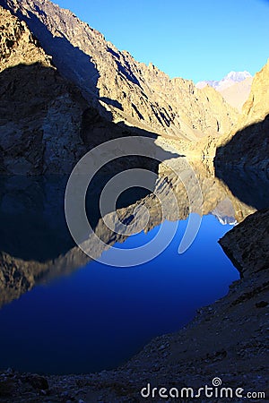 Reflection of rocky mountain and blue sky Stock Photo