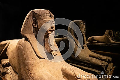 Reflection of a stone Egyptian sphinx in perspective in a dark room Editorial Stock Photo