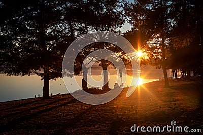 Reflection of sun on water surface. Golden hour and sunset on lake Editorial Stock Photo