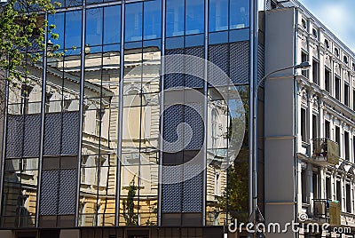 Reflections of old building in windows in Lodz Stock Photo