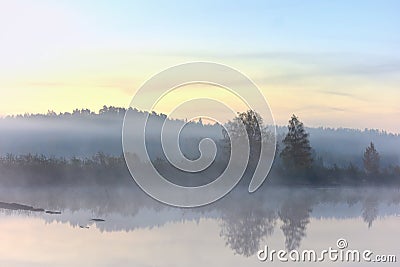 Reflections of sunrise at quiet lake in The Lithuania Stock Photo