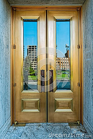 Reflections in the windows of the main doors of the State Capitol in Boise, Idaho, USA - August 13, 2013 Editorial Stock Photo