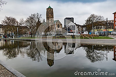 Overview of church and business in the park Editorial Stock Photo