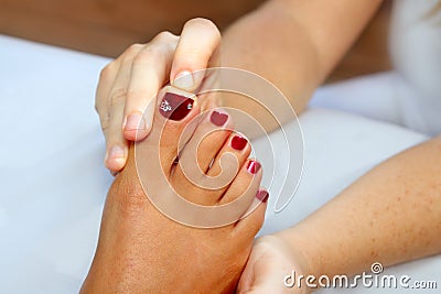 Reflexology woman feet massage therapy Stock Photo