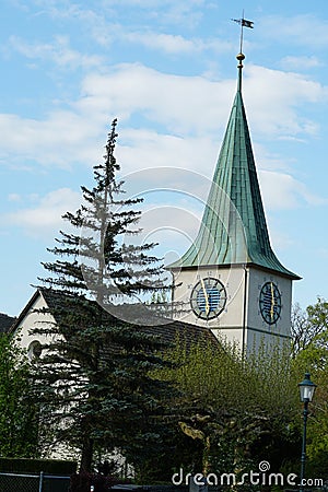 Reformed church in Schlieren, Switzerland, surrounded by trees of a nearby park Editorial Stock Photo