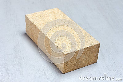 Refractory brick for masonry fireplaces and stoves on grey background Stock Photo