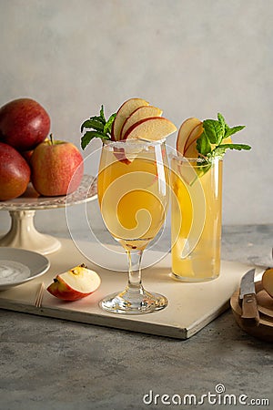 Refreshing apple cocktail drinks with fresh red apples Stock Photo