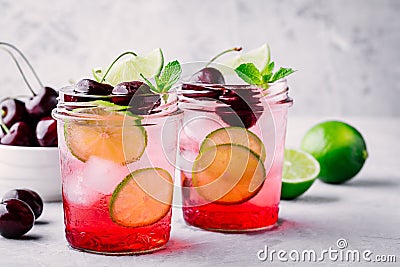 Refreshing cold summer drink cherry and lime lemonade Stock Photo