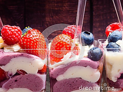 Ice cream, berries, strawberry, blueberry, raspberry, pistachios, nuts, sorbet, jam and biscuit, summer dessert, sweet snack Stock Photo