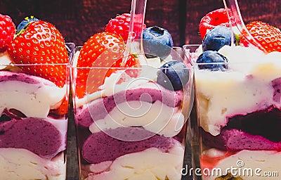 Ice cream, berries, strawberry, blueberry, raspberry, pistachios, nuts, sorbet, jam and biscuit, summer dessert, sweet snack Stock Photo