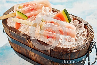 Refreshing frozen watermelon popsicles in a tub Stock Photo