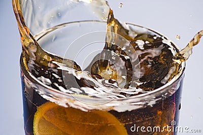 Refreshing glass of cola with lemon and ice Stock Photo