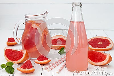 Refreshing grapefruit cocktail with mint over old vintage wooden table. Stock Photo