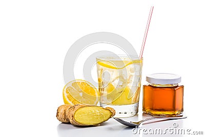 Refreshing ice cold honey ginger lemon tea in transparent glass Stock Photo