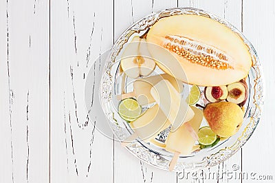 Refreshing ice pops over silver tray. Pear, peach, grape, lime, honeydew white sangria paletas - popsicles. Top view Stock Photo