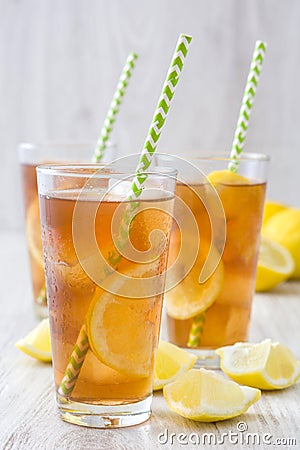 Refreshing iced tea with lemon on white wood Stock Photo