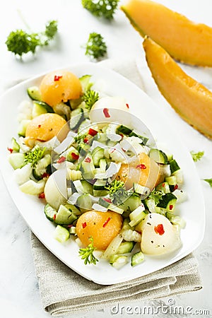 Refreshing melon salad with cucumber and chili Stock Photo