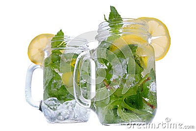 Refreshing mint and lemon drink in glass jars Stock Photo