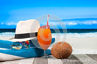 Refreshing orange cocktail on beach table. Vacation at Paradise Stock Photo