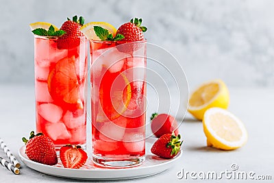 Refreshing Strawberry Mint and lemon Iced Tea or lemonade in glasses Stock Photo