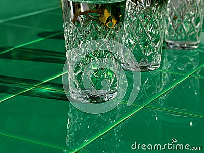 Refreshing summer drinks in crystal glasses on yellow bar tile background with harsh shadows Sweet cold natural cocktail Stock Photo