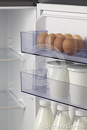 Refrigerator full of eggs and milk Stock Photo