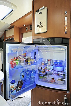 Refrigerator with open door in a camper Editorial Stock Photo