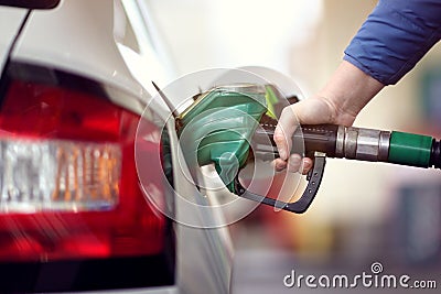 Refuel the car at a gas station fuel pump Stock Photo