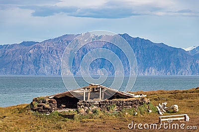 A refuge - harborage made by stones and wood on the coastline in Pond Inlet, Baffin Island, Canada Stock Photo