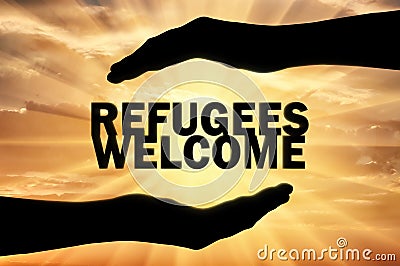 Refugees are welcome, words are in the hands of a man Stock Photo