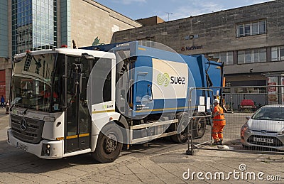 Refuse truck leaving site in Plymouth City Centre, UK Editorial Stock Photo
