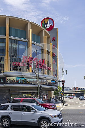 Regal LA Live on Olympic Blvd with cars and trucks driving on the street, traffic signals, light posts, blue sky and clouds Editorial Stock Photo