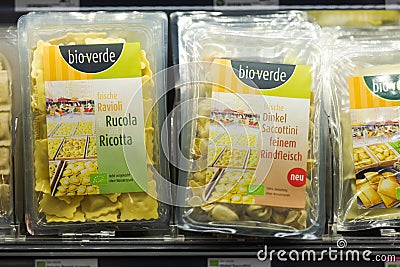 Regensburg, Germany - 2021 02 05: Refrigerated section with packaged various fresh pasta of brand bio-verde behind glass doors on Editorial Stock Photo