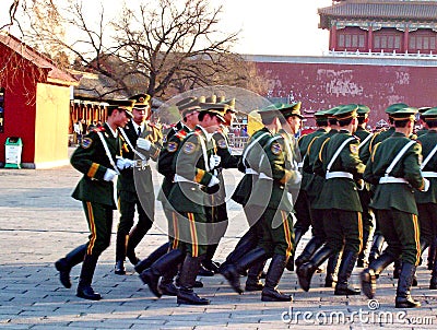 Regimented Chinese People`s Liberation Army soldiers march inside Forbidden City Editorial Stock Photo
