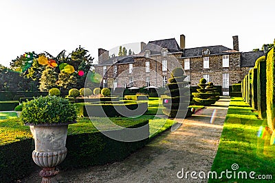 Regular garden in little french castle, sunset time Stock Photo