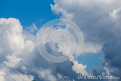 Regular spring clouds on blue sky at daylight in continental europe. Close shot with telephoto lens Stock Photo