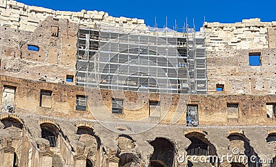 Rehabilitation works inside the Colosseum in Rome with scaffolding above the vaulted arches, Italy. Stock Photo