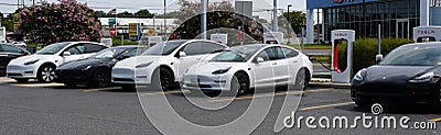 Rehoboth Beach, Delaware, U.S.A - September 3, 2022 - Tesla cars on the charging station Editorial Stock Photo