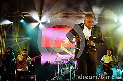 Rei Helder, Stage Musicians, Angola Flag Background, Celebrity Dancing Editorial Stock Photo