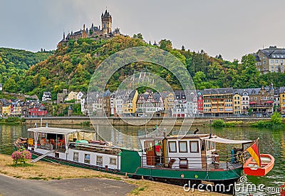 Reichsburg Castle and Unique House Boat in Medieval Village of Cochem, Germany Editorial Stock Photo