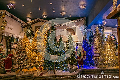 The reign of Santa Claus shop with christas trees, lights and decorations Editorial Stock Photo