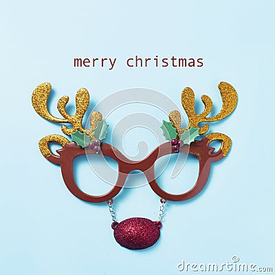 Reindeer eyeglasses and text merry christmas Stock Photo