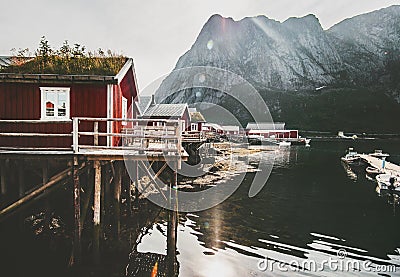 Reine village in Norway popular traditional rorbu red wooden houses at sea Stock Photo