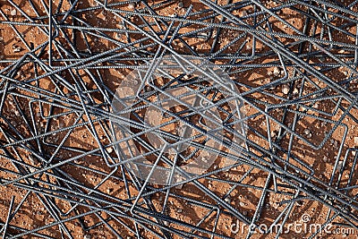 Reinforcing steel bars or rebar on ground background showing strenght and toughness. Stock Photo