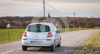 Car driving on a small country road in the Vosges moutains Editorial Stock Photo