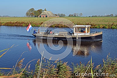 The Reitdiepveer with passengers, sailing over the Reitdiep in Groningen. Editorial Stock Photo